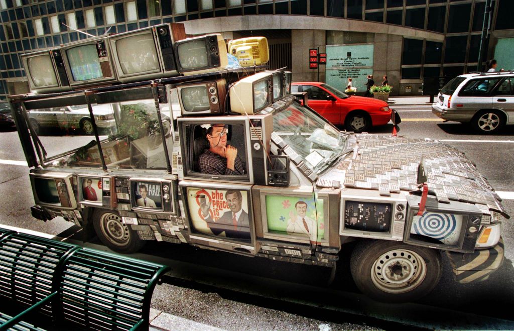 Blank’s ‘The Amazing T.V. Car,’ a converted pickup truck, features more than 20 working television sets and a hood created out of more than 100 remote controls. Mike Segar/Reuters